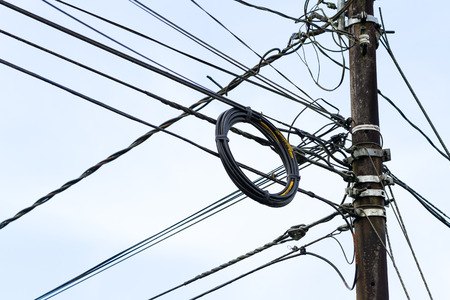 Turrialba, Costa Rica - May 21 : Power lines and phone lines hanging from concrete poles. May 21 2016, Turrialba Costa Rica.のeditorial素材