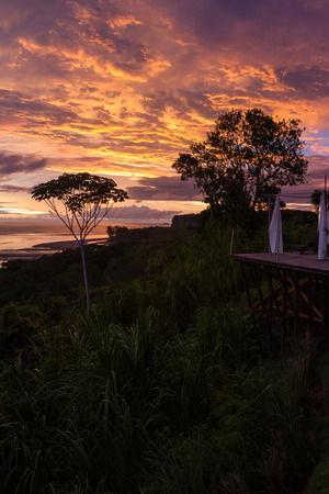 peaceful sunset scene with clouds above the pacific ocean in Uvita, Costa Ricaの写真素材