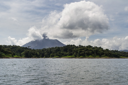 beautiful view of Arenal Volcano from the middle of the lake for a different perspectiveの写真素材