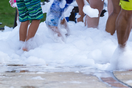 peoples feet in a foam party as hotel entertainment in Panamaの写真素材