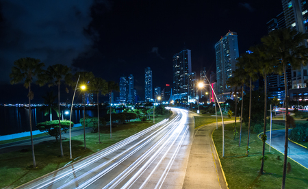 Panama City, Panama- June 08: Buildings and infrastructure in Panama City viewed at night from an overpass with vehicle lights implying motion. June 08 2016, Panama City, Panama.のeditorial素材