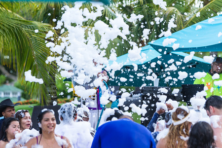 Santa Clara, Panama- June 10: tourists enjoying the music and foam gun as part of the hotel entertainment. June 10 2016, Santa Clara, Panama.のeditorial素材