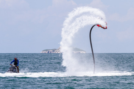 Santa Clara, Panama- June 12: Local people enjoying a thrilling experience on a flyboard in the Pacific ocean. June 12 2016, Santa Clara, Panama.のeditorial素材