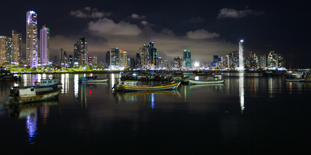 Panama City, Panama- June 08: Twilight Cityscape from across the bay in Panama with a serene reflection on the water. June 08 2016, Panama City, Panama.のeditorial素材