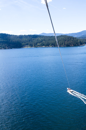 Coeur d' Alene, Idaho - August 12: Exiting summer parasailing adventure in lake Coeur d' Alene. August 12 2016, Coeur d' Alene, Idaho.のeditorial素材