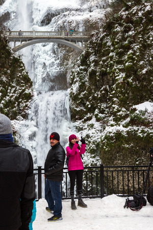 Multnomah, Oregon - December 17: Polar vortex at the end of 2016 bringing extreme low temperatures and tourists to view Multnomah Falls in rare icy conditions. December 17 2016 Multnomah, Oregon.のeditorial素材