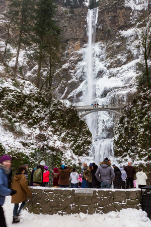 Multnomah, Oregon - December 17: Polar vortex at the end of 2016 bringing extreme low temperatures and tourists to view Multnomah Falls in rare icy conditions. December 17 2016 Multnomah, Oregon.のeditorial素材