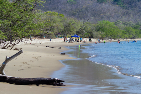 Junquillal, Guanacaste, Costa Rica - April 10: Beautiful beach in the northern pacific of Costa Rica with families enjoying time in the water. April 10 2017, Junquillal, Guanacaste, Costa Rica.のeditorial素材