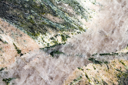 close up of  green granite countertop with a vein of quartz crystal thru the middle of itの写真素材