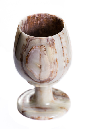 close up of a beautiful onyx cup with unique swirls and layers isolated on a white backgroundの写真素材