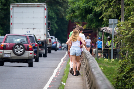 Puntarenas, Costa Rica - July 18 : Tourists walking on the Tarcoles bridge, a famous crocodile viewing place. July 18 2017, Puntarenas, Costa Rica.のeditorial素材