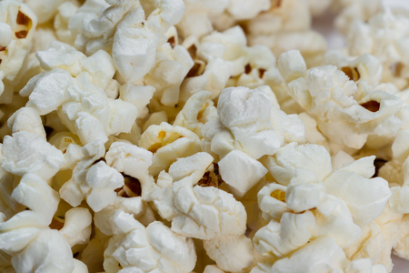 close up of a bunch of popcorn on a white backgroundの写真素材