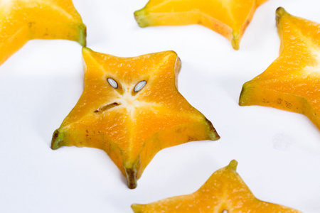 sliced carambola or starfruit isolated on a white background