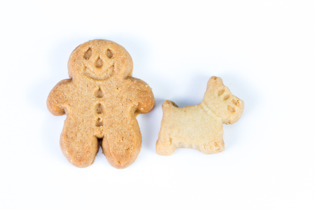 group of gingerbread man standing together with their scotty dog on a white backgroundの写真素材