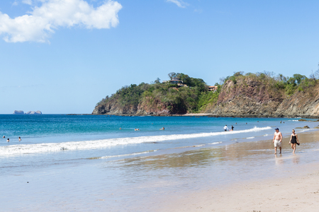 Playa Flamingo, Costa Rica - December 25: Locals and tourists enjoying Christmas day at the  beach. December 25 2017, Playa Flamingo Costa Rica.のeditorial素材