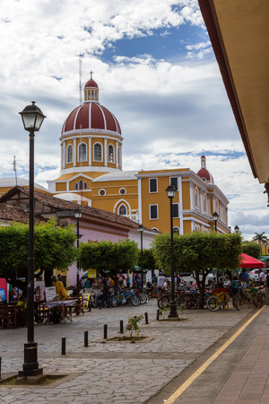 Granada, Nicaragua - January 20: Bike rentals and restaurants on this busy street of La Calzada in Granada. January 20 2018, Granada, Nicaraguaのeditorial素材