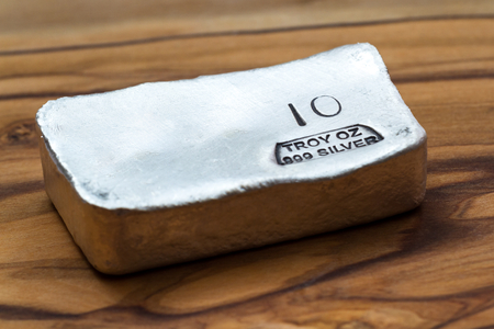 Close up of a 10 gram bar of poured silver as a precious metal holdingの写真素材
