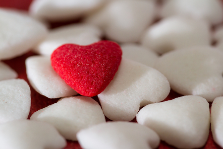 close up of small heart shaped edible sugar to be used as toppings for dessertsの写真素材