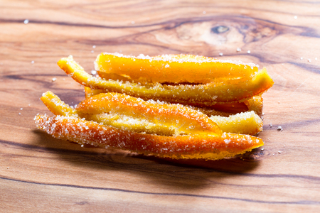 macro image of home made candied orange peel with large sugar granulesの写真素材