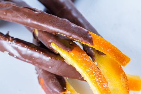 macro image of home made candied orange peel dipped in chocolateの写真素材