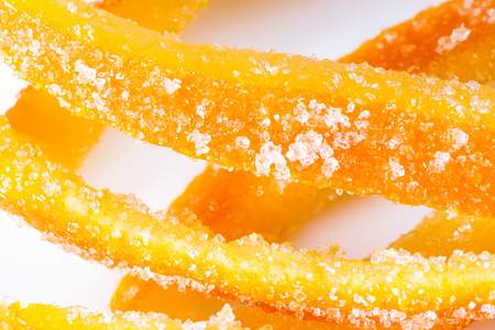 macro image of home made candied orange peel with large sugar granulesの写真素材