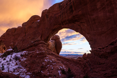 beautiful colorful clouds seen above north window in Arches National Parkの写真素材