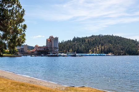 CDA, Idaho - June 12: Beautiful view of the beach and the Coeur d' Alene Resort with tubs hill in the background. June 12, CDA, Idaho.のeditorial素材