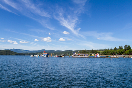 CDA, Idaho - June 12: View of the dock at Independence point in CDA Idaho with a seaplane, parasail boat and a cruise boat ready for adventure and fun. June 12 2018, CDA, Idahoのeditorial素材
