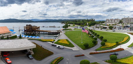 CDA, Idaho - June 13: Panoramic view from the top of the Resorts Parking lot with beautiful gardens, Hagadone Marine Group, Independence Point and the beginning of downtown CDA in the frame. June 13 2018, CDA, Idahoのeditorial素材