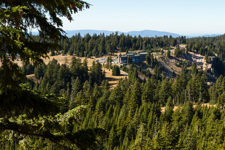 Crater Lake NP, Oregon - October 18: Boarding up the windows for the season at the Crater Lake Lodge viewed from a viewpoint along the Garfields peak trail. October 18, Crater Lake NP, Oregon.のeditorial素材