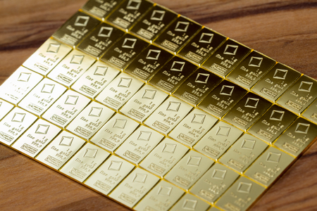 Medford, Oregon - November 04: Close up of a Valcambi gold bar perforated into breakable 1 oz pieces of gold. November 04, Medford, Oregon.のeditorial素材