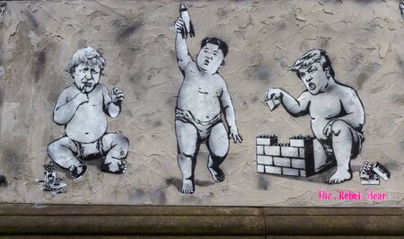 Edinburgh, Scotland - September 14 2019: Street art depicting Donald Trump, Boris Johnson and Kim Jung as toddlers on display in the Edinburgh city centre, September 14,  2019のeditorial素材