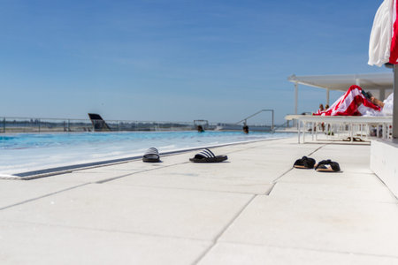 JFK Airport, Queens NY  - September 03 2019: Rooftop infinity pool overlooking the runway at the TWA...