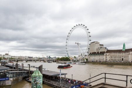 London  - September 06 2019: Water taxi traveling on the River Thames with the London Eye in the background, London September 06,  2019のeditorial素材