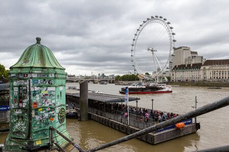 London  - September 06 2019: Water taxi traveling on the River Thames with the London Eye in the background, London September 06,  2019のeditorial素材