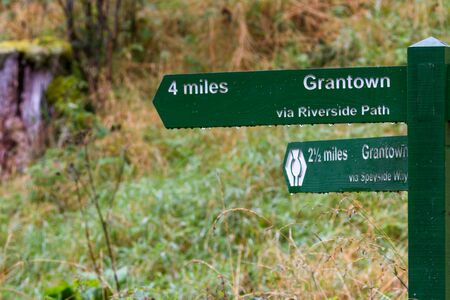 trail marker in the highlands of Scotland marking the footpathの写真素材