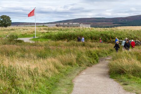 Scotland  - September 08 2019: Tourists walking on the path experiencing the Culloden Battlefield, Scotland, UK September 08,  2019のeditorial素材