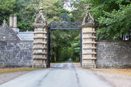 Perthshire Scotland  - September 12 2019: Front gates and a long driveway leading up to the front of...