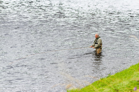 Scotland  - September 09 2019: Man fly fishing on the Spay river near Grantown, UK September 09,  2019のeditorial素材