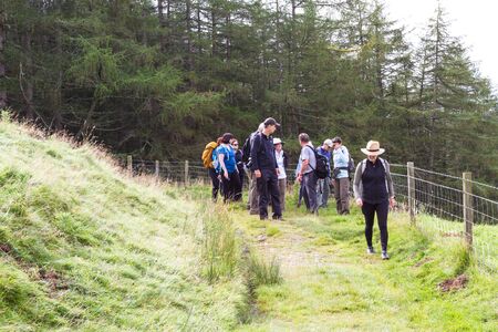 Pitlochry Scotland  - September 10 2019: Group of tourists walking gin the Scottish Highlands, UK September 10,  2019のeditorial素材