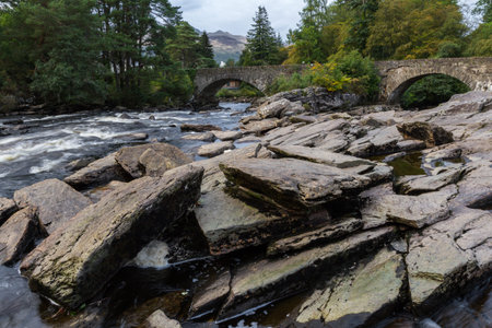 Beautiful Dochart falls in Killin Scotland with lots of rocks and low flow in the river in autumn...