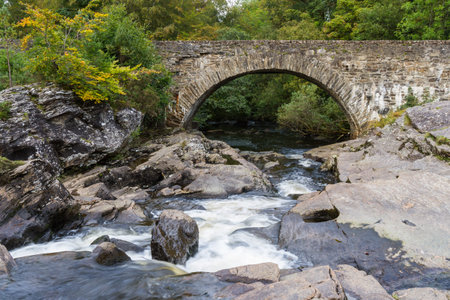 Beautiful Dochart falls in Killin Scotland with lots of rocks and low flow in the river in autumn...