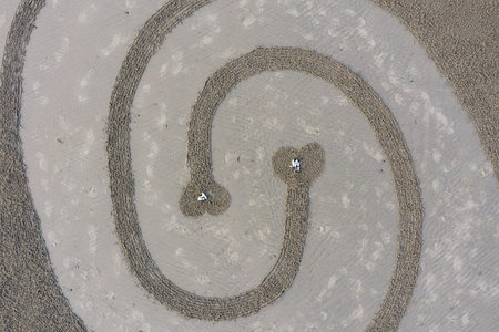 Bandon by the Sea, Oregon / USA - March 08 2020: Detailed artwork created by the team of Circles in the Sand on the beach of Face Rock State Parkのeditorial素材