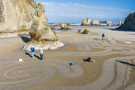 Bandon by the Sea, Oregon / USA - March 13 2020: Detailed artwork created by the team of Circles in the Sand on the beach of Face Rock State Parkのeditorial素材