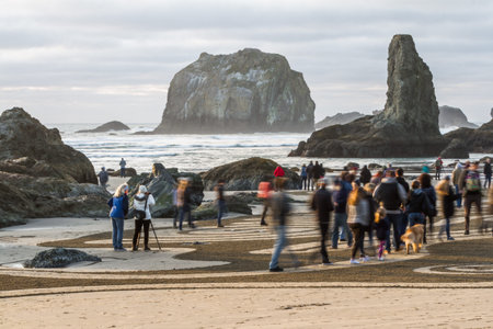 Bandon by the Sea, Oregon / USA - February 21 2020: People walking through a labyrinth made by the team of Circles in the Sand. Slow shutter speed used for a moving concept.のeditorial素材