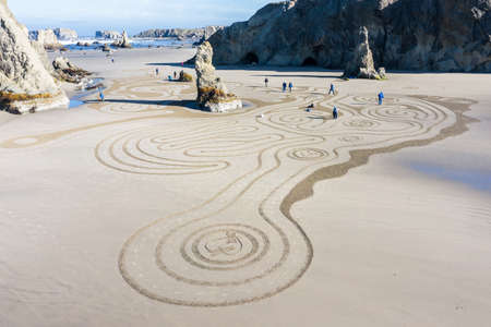 Bandon by the Sea, Oregon / USA - March 13 2020: Detailed artwork created by the team of Circles in the Sand on the beach of Face Rock State Parkのeditorial素材