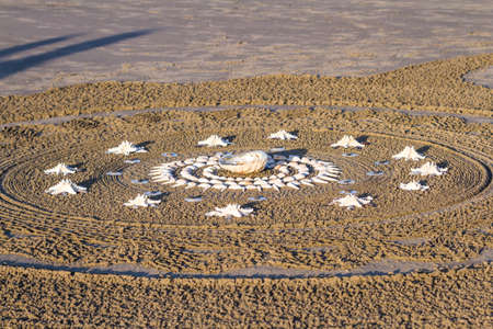 Bandon by the Sea, Oregon / USA - February 20 2020: Artwork created by the team of Circles in the Sand on the beach of Face Rock State Parkのeditorial素材