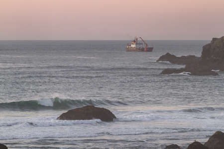 Bandon by the Sea, Oregon / USA - February 20 2020: US Coast Guard ship dredging in the southern Oregon coastのeditorial素材