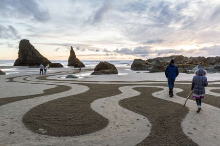 Bandon by the Sea, Oregon / USA - March 07 2020: People walking the labyrinth created by the team of Circles in the Sand in Bandon, Oregonのeditorial素材