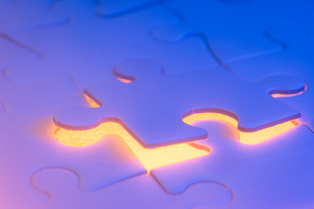 close up of a blank puzzle with a blue and orange light as a concept.の写真素材